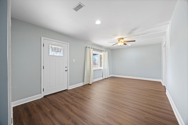 foyer with ceiling fan and dark wood-type flooring