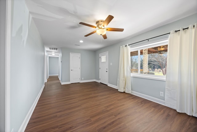 spare room with ceiling fan and dark hardwood / wood-style floors