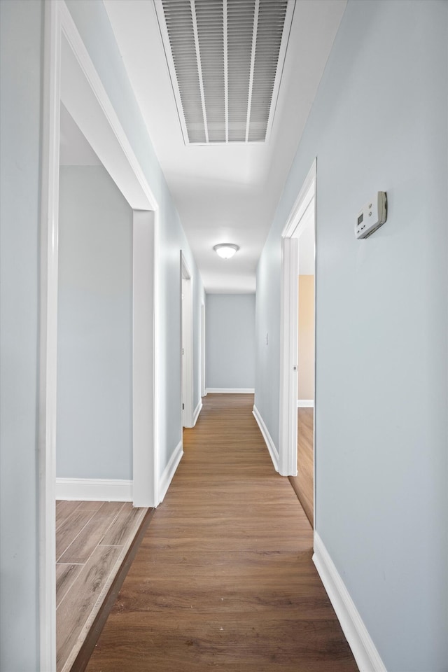 corridor featuring hardwood / wood-style flooring