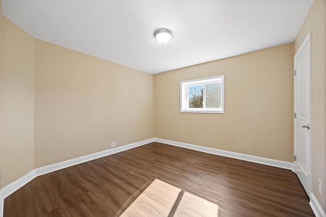 empty room featuring dark wood-type flooring