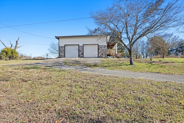 garage featuring a yard