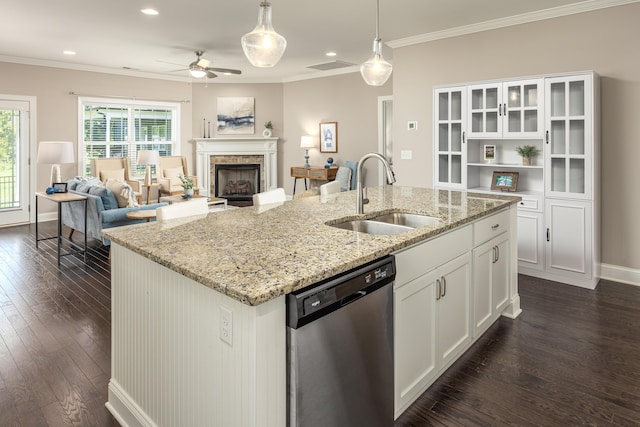 kitchen featuring pendant lighting, dishwasher, white cabinets, sink, and dark hardwood / wood-style floors