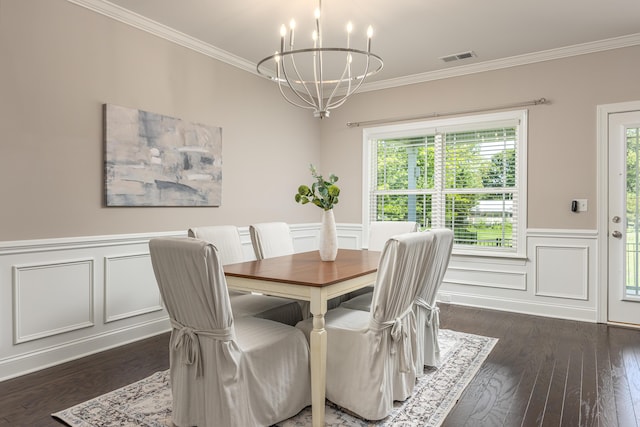 dining room with ornamental molding, dark wood-type flooring, and a notable chandelier