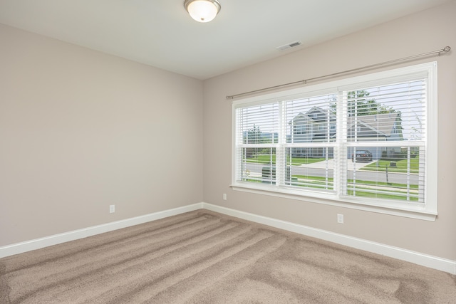 unfurnished room with carpet flooring