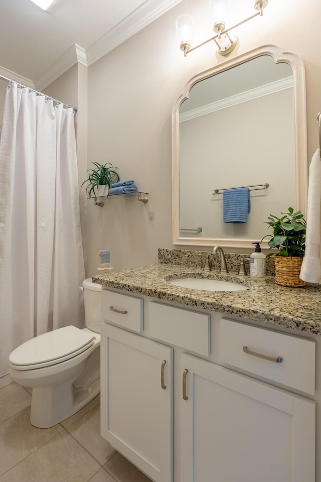 bathroom featuring tile patterned flooring, vanity, toilet, and ornamental molding