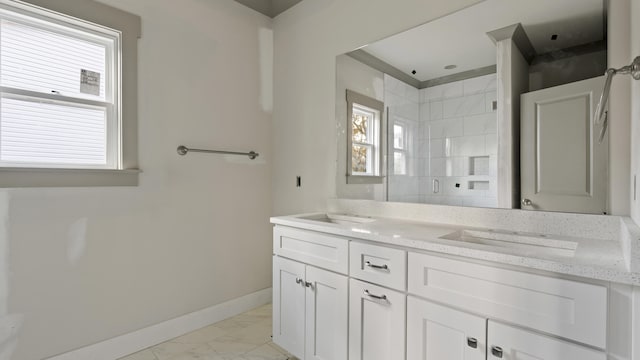 bathroom with vanity and a shower with shower door