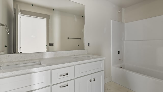 bathroom featuring vanity and bathing tub / shower combination