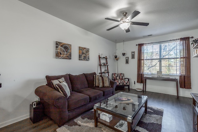 living room with ceiling fan and dark hardwood / wood-style floors