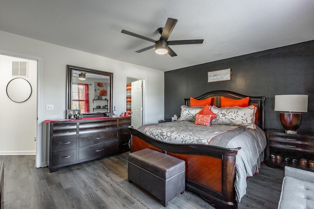 bedroom featuring dark hardwood / wood-style floors and ceiling fan