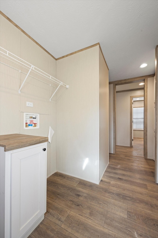 laundry room featuring washer hookup and dark hardwood / wood-style flooring