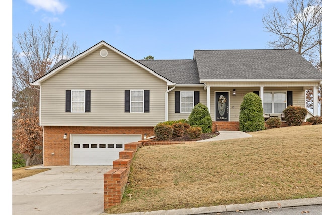 view of front facade with a garage and a front yard