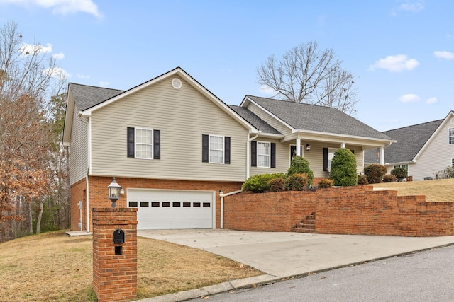 view of front of house with a garage and a front lawn