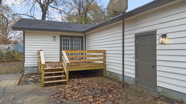 doorway to property featuring a wooden deck