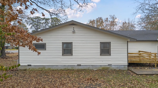 view of side of home featuring a deck