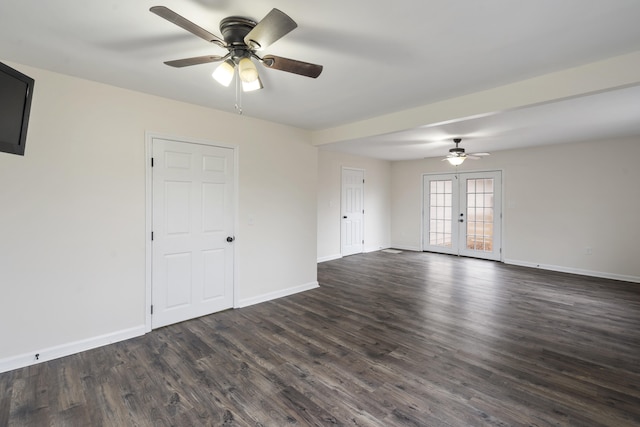 empty room featuring ceiling fan, dark hardwood / wood-style flooring, and french doors