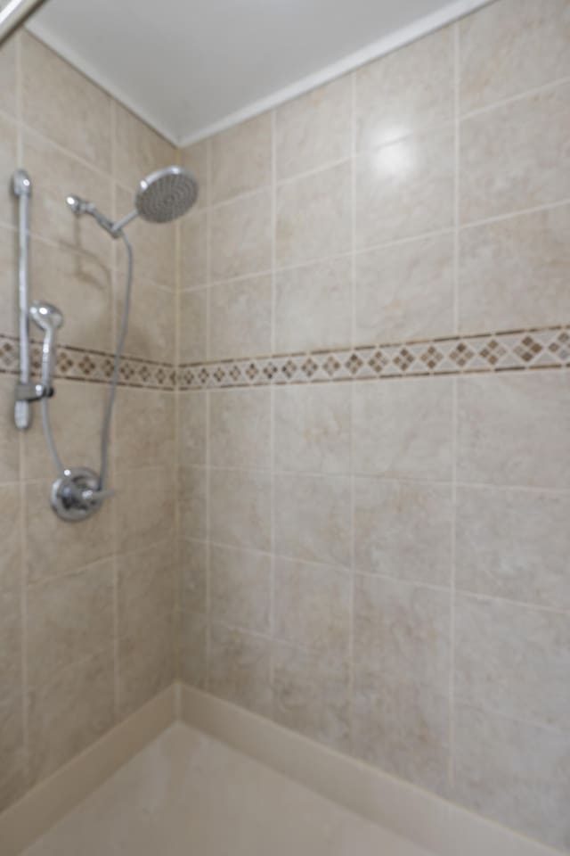 bathroom with a tile shower