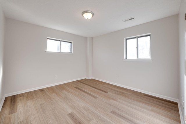 unfurnished room with light hardwood / wood-style flooring