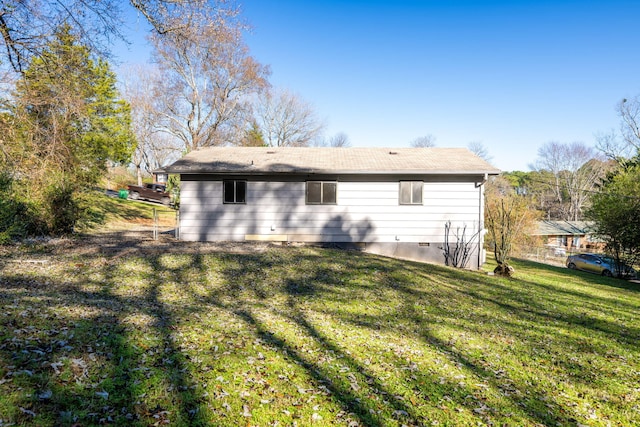 rear view of house with a lawn