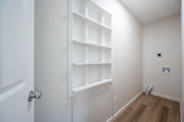 clothes washing area with a textured ceiling, dark hardwood / wood-style flooring, hookup for an electric dryer, and hookup for a washing machine