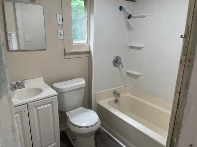 full bathroom with vanity, toilet, and  shower combination