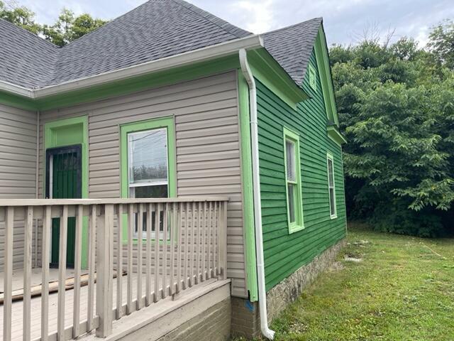 view of side of home featuring a yard