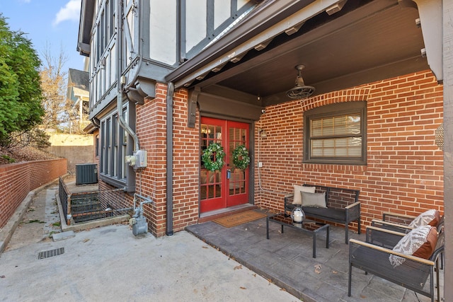 property entrance featuring central AC, a patio area, and french doors