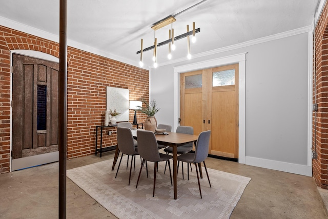 dining room with crown molding and brick wall