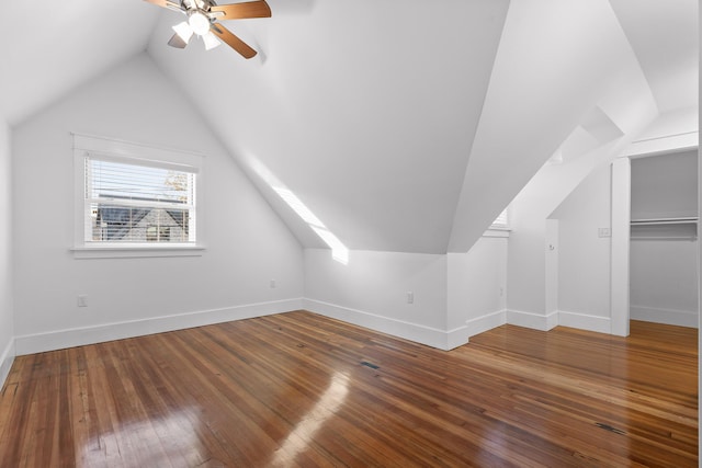 additional living space featuring ceiling fan, lofted ceiling, and hardwood / wood-style flooring