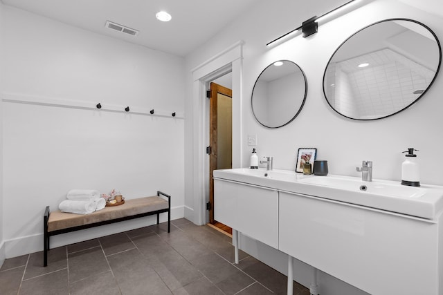 bathroom with tile patterned floors and vanity