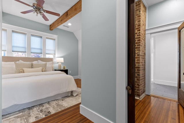 bedroom featuring beam ceiling, ceiling fan, and dark wood-type flooring