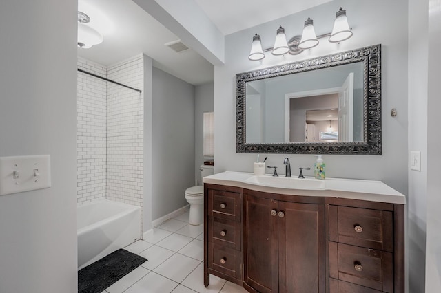 full bathroom featuring toilet, vanity, tile patterned floors, and tiled shower / bath combo