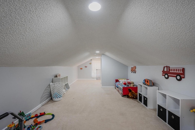 game room with carpet, a textured ceiling, and lofted ceiling