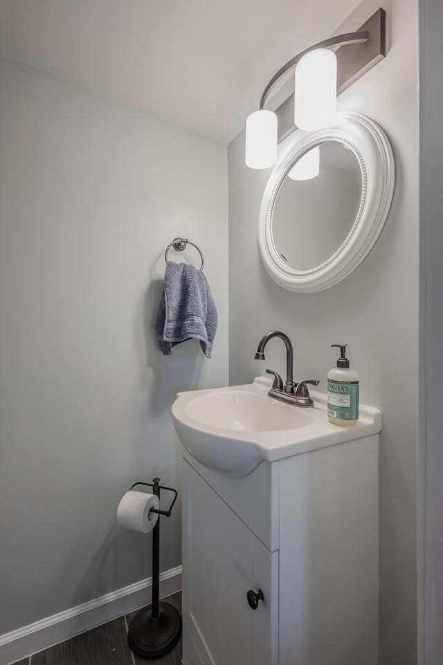 bathroom with vanity and hardwood / wood-style flooring