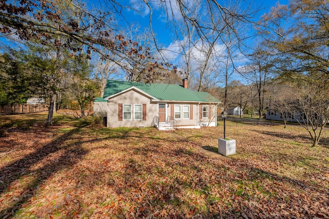 ranch-style house with a front lawn