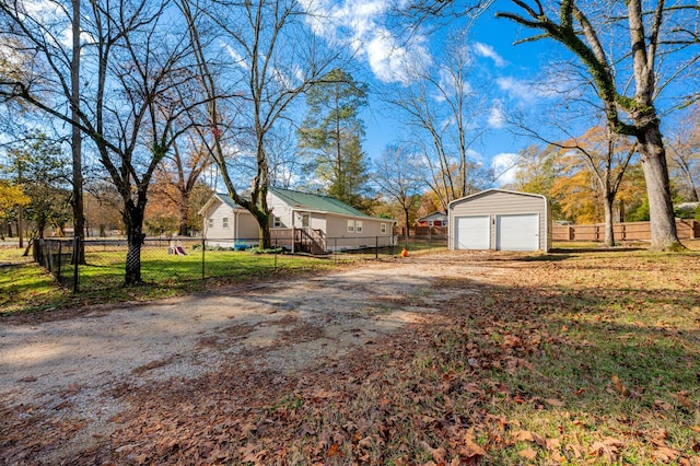 view of yard with an outbuilding and a garage