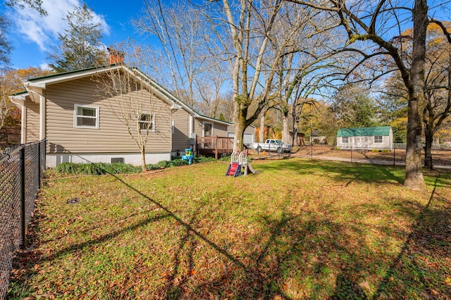 view of yard with a wooden deck