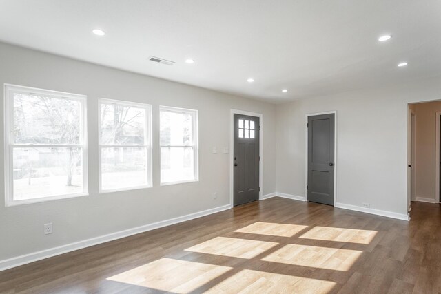 entryway with hardwood / wood-style floors