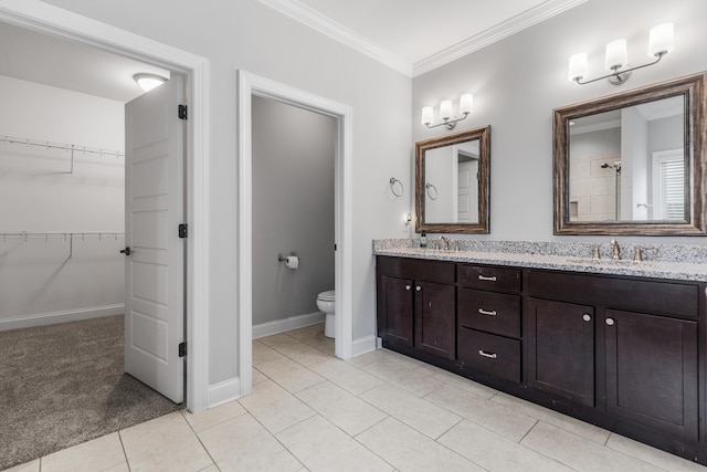 bathroom featuring tile patterned floors, toilet, vanity, and ornamental molding