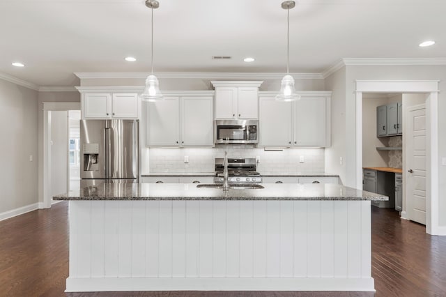 kitchen featuring light stone countertops, dark hardwood / wood-style flooring, stainless steel appliances, a center island with sink, and white cabinets