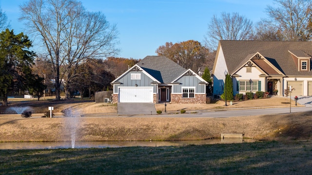 view of front facade featuring driveway, a front lawn, and board and batten siding