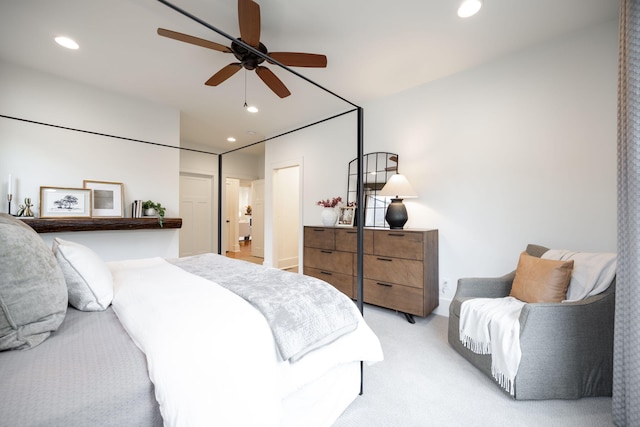 bedroom with light colored carpet and ceiling fan