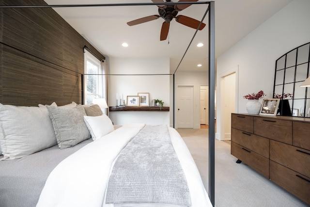 carpeted bedroom with ceiling fan