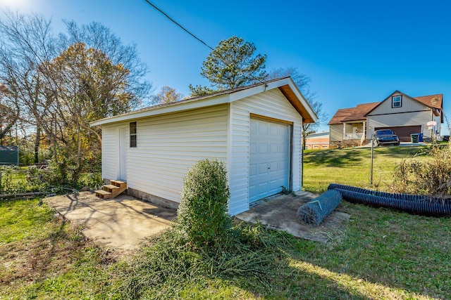 garage featuring a lawn