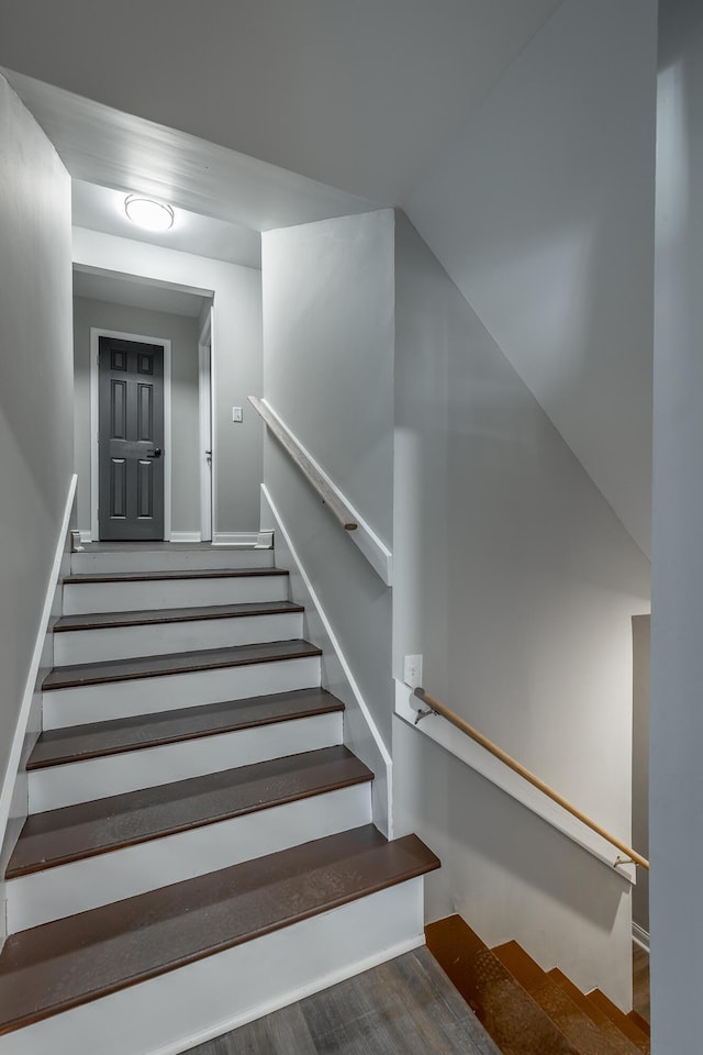 stairway with wood-type flooring