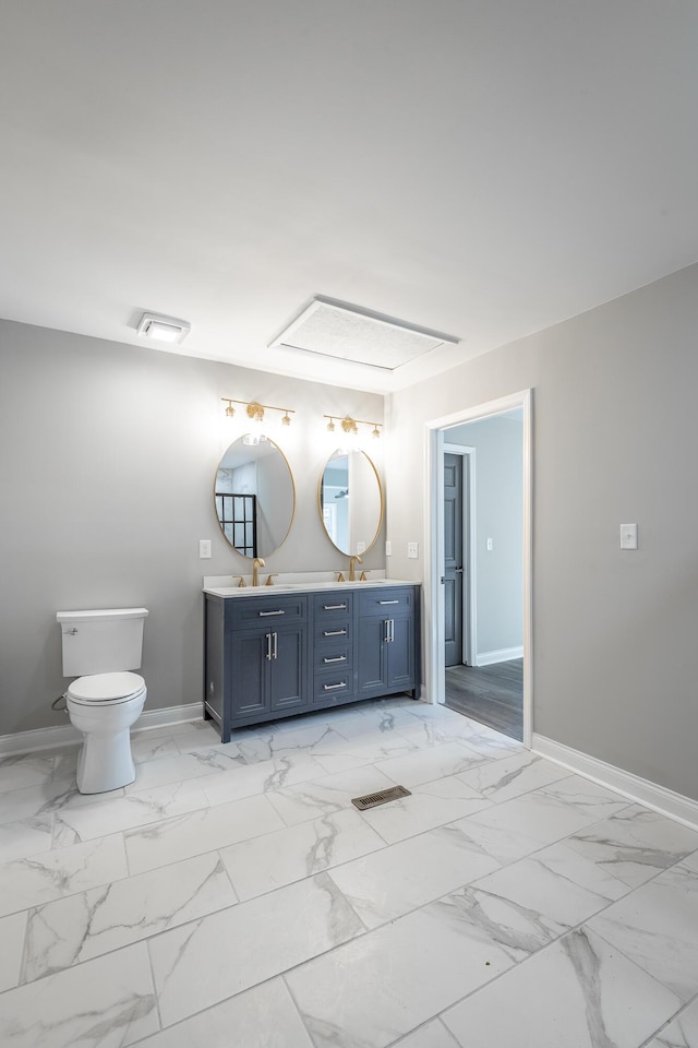 bathroom with vanity and toilet