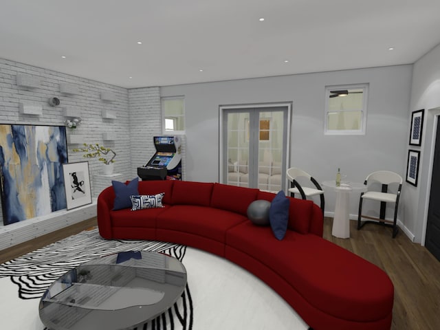 living room with dark wood-type flooring and brick wall