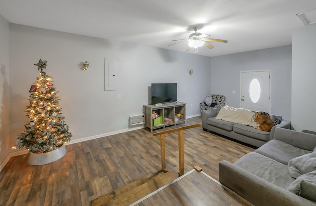 living room featuring ceiling fan and dark hardwood / wood-style flooring