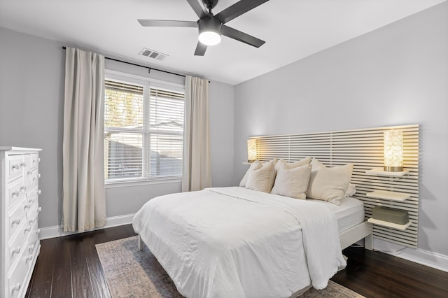 bedroom with visible vents, ceiling fan, baseboards, and wood-type flooring