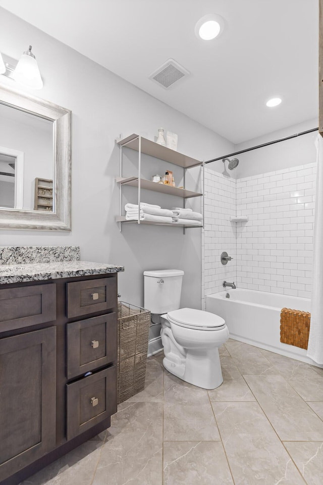 full bath featuring visible vents, toilet, vanity, and bathtub / shower combination