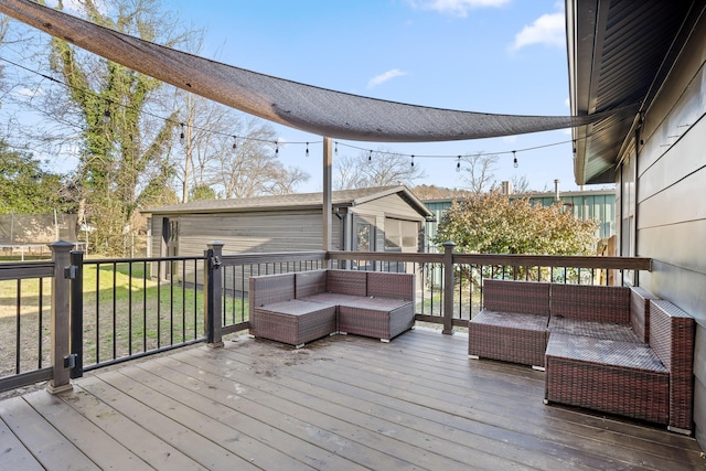 wooden deck with an outdoor living space